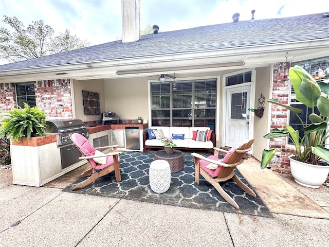 view of patio with outdoor lounge area, a grill, an outdoor kitchen, and ceiling fan