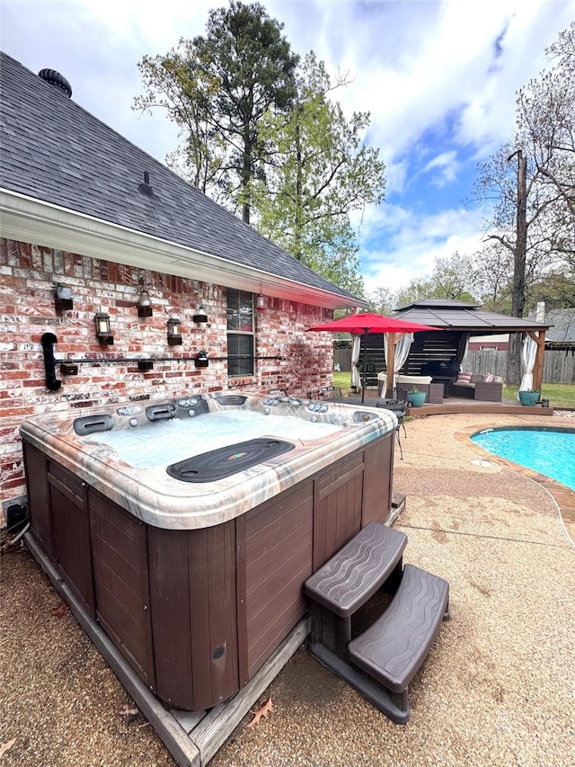outdoor pool with a patio, central AC unit, a hot tub, a gazebo, and fence