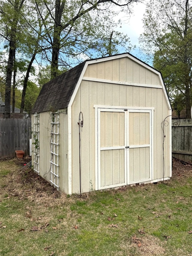 view of shed with fence