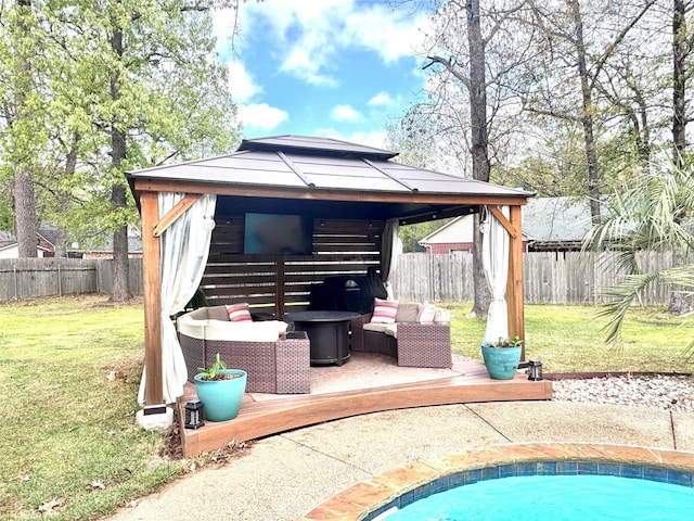 exterior space featuring a gazebo, a fenced backyard, and a deck