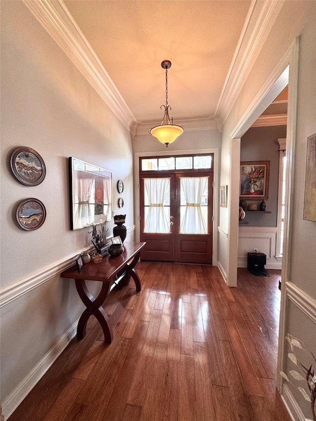 entrance foyer featuring crown molding, french doors, and wood-type flooring