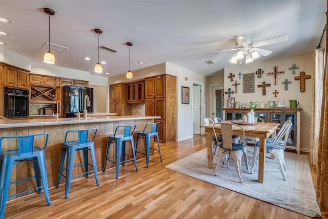 328 S Jackson Ave, Justin, TX 76247 - dining space with ceiling fan, light wood finished floors, baseboards, and recessed lighting