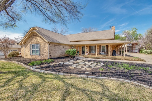 328 S Jackson Ave, Justin, TX 76247 - ranch-style house with brick siding, a chimney, a front lawn, covered porch, and a shingled roof