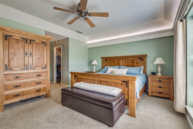 328 S Jackson Ave, Justin, TX 76247 - bedroom with light colored carpet, a walk in closet, a closet, and ceiling fan