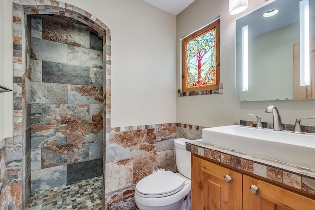 328 S Jackson Ave, Justin, TX 76247 - bathroom with a walk in shower, toilet, tile walls, and vanity