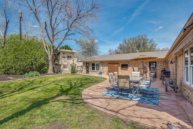 328 S Jackson Ave, Justin, TX 76247 - view of green lawn featuring a patio and outdoor dining space
