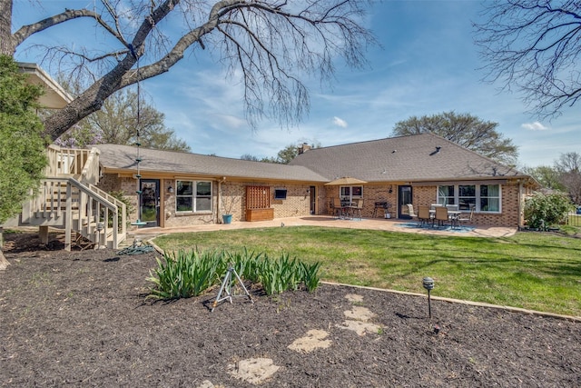 328 S Jackson Ave, Justin, TX 76247 - back of house with a patio, brick siding, a lawn, and a chimney