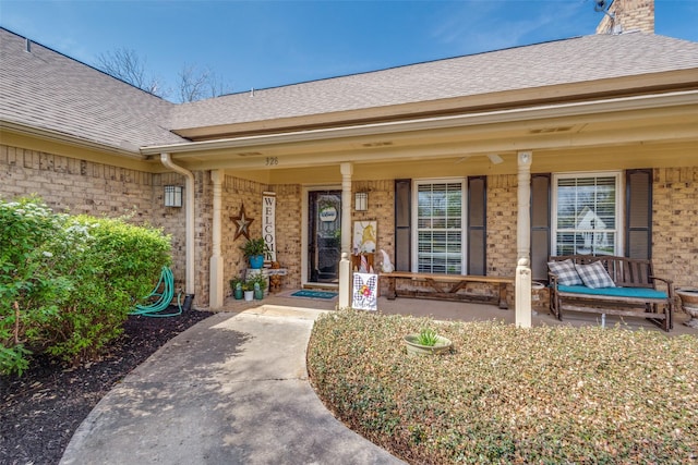 328 S Jackson Ave, Justin, TX 76247 - entrance to property featuring brick siding, a porch, and a shingled roof