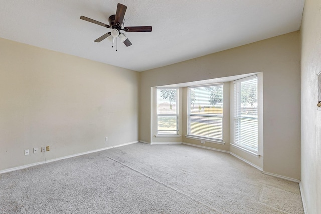 102 Cedar Dr, Oak Leaf, TX 75154 - carpeted spare room with baseboards, a healthy amount of sunlight, and ceiling fan
