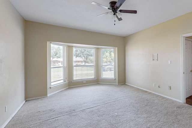 102 Cedar Dr, Oak Leaf, TX 75154 - unfurnished room featuring baseboards, ceiling fan, carpet, and a healthy amount of sunlight