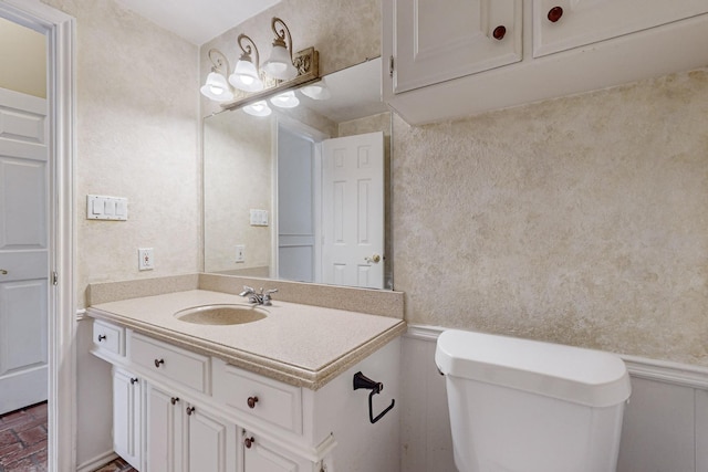 102 Cedar Dr, Oak Leaf, TX 75154 - bathroom featuring toilet, vanity, and brick floor