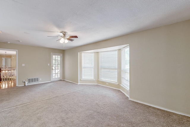 102 Cedar Dr, Oak Leaf, TX 75154 - empty room featuring a textured ceiling, visible vents, baseboards, ceiling fan, and carpet floors