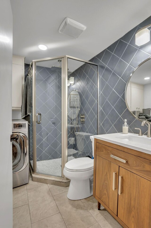 4901 Fairway Ct, De Cordova, TX 76049 - bathroom with vanity, tile walls, toilet, washer / dryer, and a stall shower