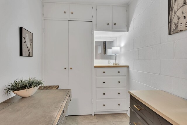 4901 Fairway Ct, De Cordova, TX 76049 - interior space with concrete block wall, tile patterned flooring, and vanity
