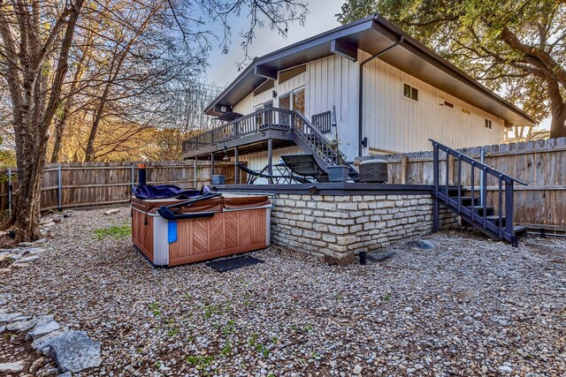 4901 Fairway Ct, De Cordova, TX 76049 - back of house featuring a fenced backyard, stairs, a deck, and a hot tub