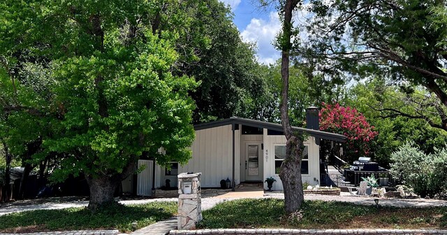 4901 Fairway Ct, De Cordova, TX 76049 - rear view of property with a chimney and board and batten siding