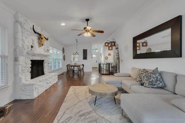 4901 Fairway Ct, De Cordova, TX 76049 - living room featuring a ceiling fan, a stone fireplace, crown molding, and wood finished floors