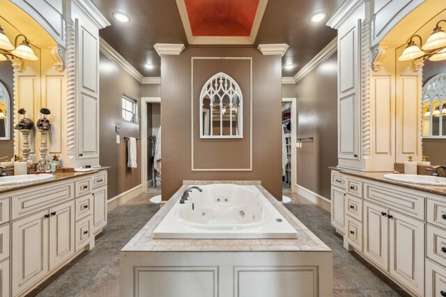 2901 Stewart Way, Tyler, TX 75709 - full bath featuring a sink, ornamental molding, two vanities, and a whirlpool tub
