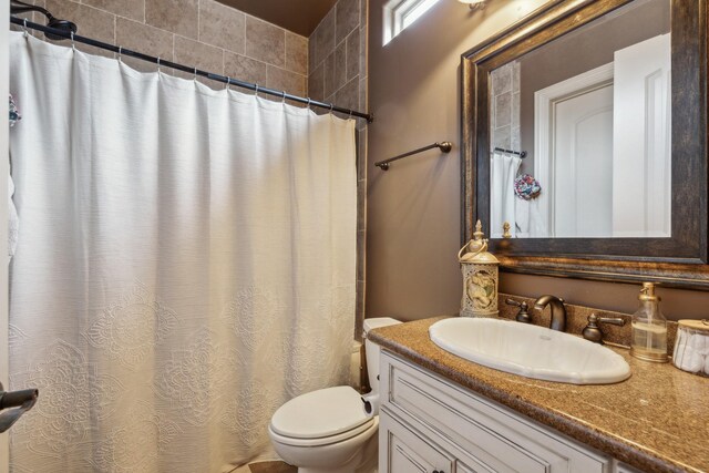 2901 Stewart Way, Tyler, TX 75709 - bathroom featuring toilet, vanity, and a shower with curtain