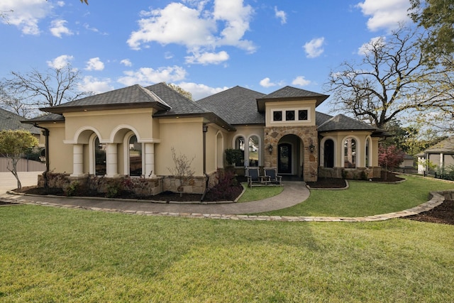 2901 Stewart Way, Tyler, TX 75709 - view of front of home with stucco siding, stone siding, and a front yard