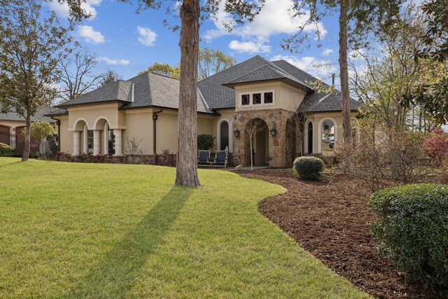 2901 Stewart Way, Tyler, TX 75709 - rear view of house featuring a chimney, stucco siding, stone siding, and a yard