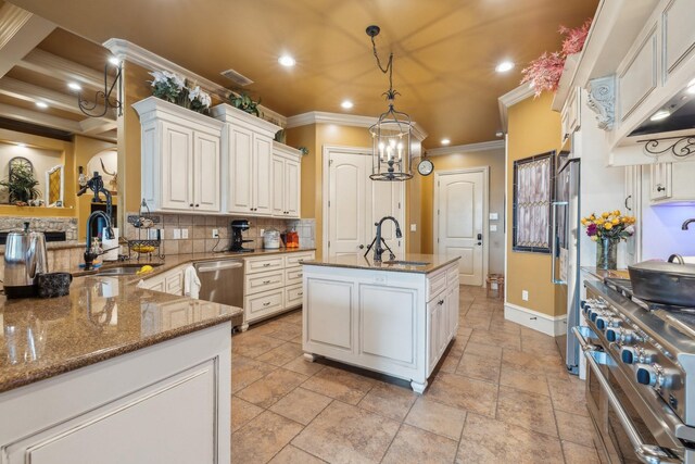 2901 Stewart Way, Tyler, TX 75709 - kitchen featuring crown molding, backsplash, stainless steel appliances, and a sink