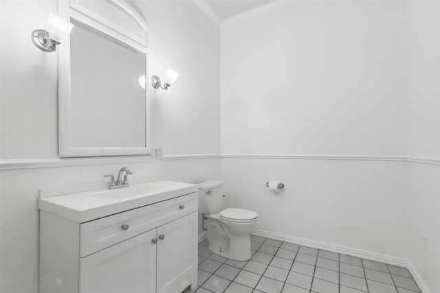 bathroom with ornamental molding, toilet, tile patterned flooring, and vanity