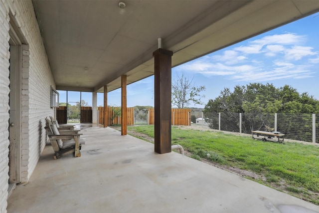 view of patio featuring fence