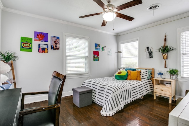 bedroom featuring baseboards, ornamental molding, visible vents, and hardwood / wood-style flooring