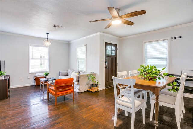 dining space with baseboards, visible vents, a healthy amount of sunlight, and wood finished floors
