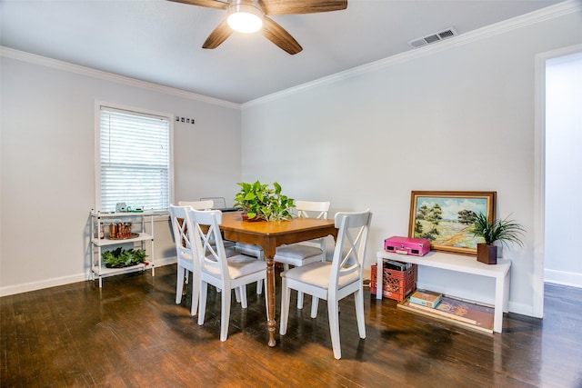 dining space featuring hardwood / wood-style floors, baseboards, ornamental molding, and visible vents