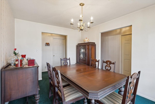 dining space with dark carpet and an inviting chandelier