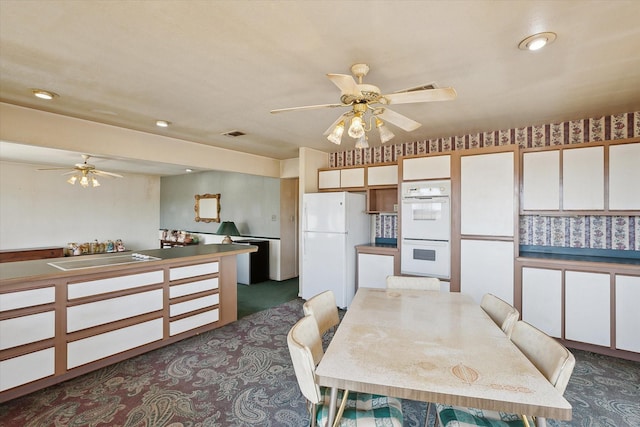 dining area featuring visible vents, dark colored carpet, recessed lighting, and a ceiling fan