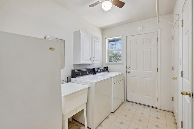clothes washing area featuring light floors, cabinet space, washer and dryer, and ceiling fan
