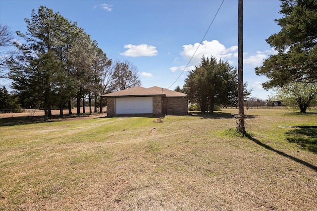 view of yard with a garage