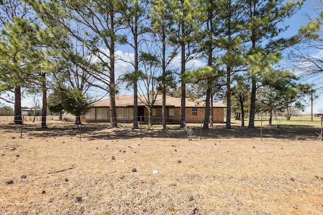 view of front of house featuring fence