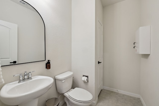 342 Meredith Dr, Fate, TX 75087 - bathroom with a sink, toilet, and baseboards