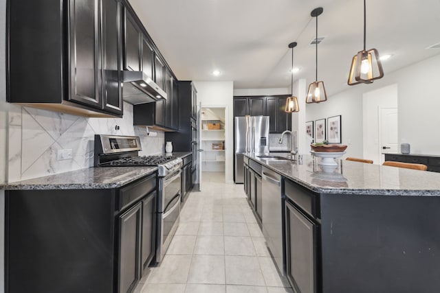 342 Meredith Dr, Fate, TX 75087 - kitchen with wall chimney range hood, stainless steel appliances, dark cabinets, a sink, and recessed lighting