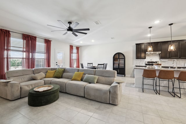 342 Meredith Dr, Fate, TX 75087 - living room with ceiling fan, light tile patterned floors, and recessed lighting