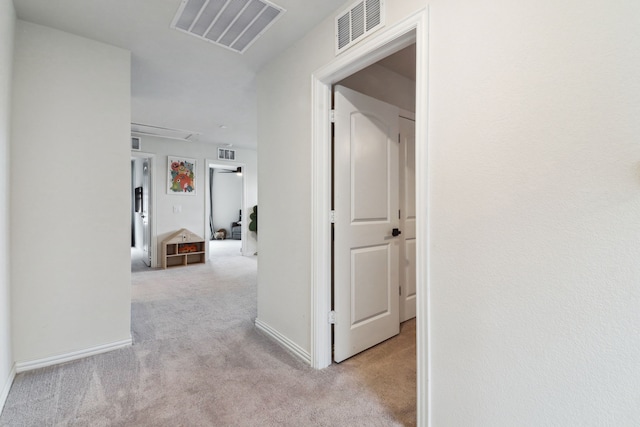 342 Meredith Dr, Fate, TX 75087 - hallway with carpet floors, attic access, and baseboards