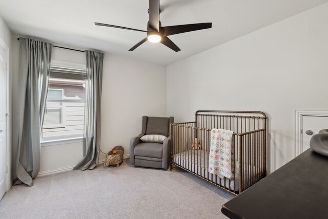 342 Meredith Dr, Fate, TX 75087 - bedroom with carpet floors, a crib, a ceiling fan, and baseboards