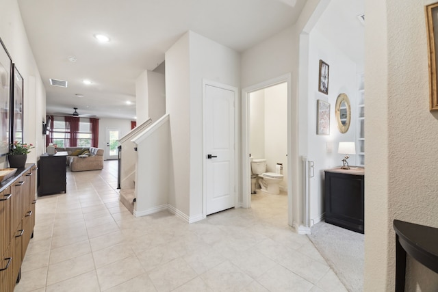 342 Meredith Dr, Fate, TX 75087 - hall with light tile patterned floors, recessed lighting, stairs, and baseboards