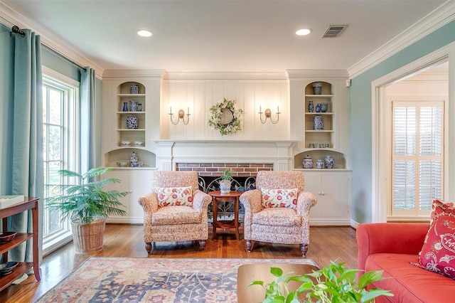 3241 Westcliff Rd W, Fort Worth, TX 76109 - living area with crown molding, wood finished floors, built in features, a fireplace, and baseboards
