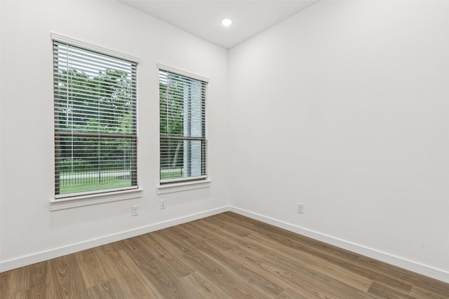 4516 Rustic Ridge Dr, Mckinney, TX 75071 - spare room featuring wood finished floors and recessed lighting