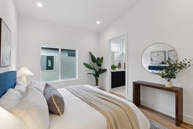 2142 Lovedale Ave Unit 101, Dallas, TX 75235 - bedroom with lofted ceiling, light wood-style flooring, baseboards, and recessed lighting