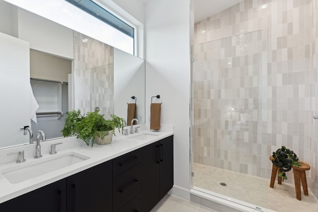 2142 Lovedale Ave Unit 101, Dallas, TX 75235 - full bathroom with a tile shower, tile patterned floors, a sink, and double vanity