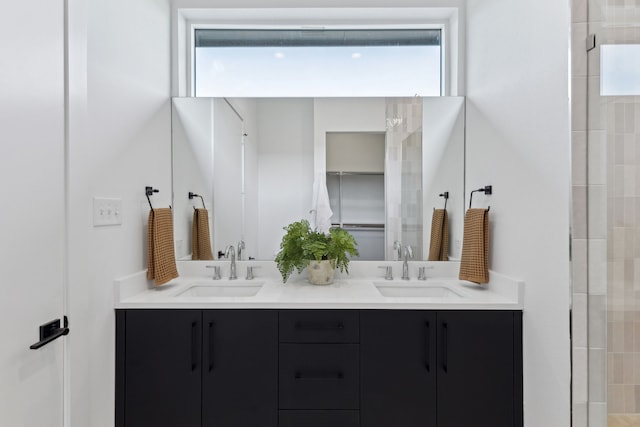 2142 Lovedale Ave Unit 101, Dallas, TX 75235 - bathroom with a tile shower, a sink, and double vanity