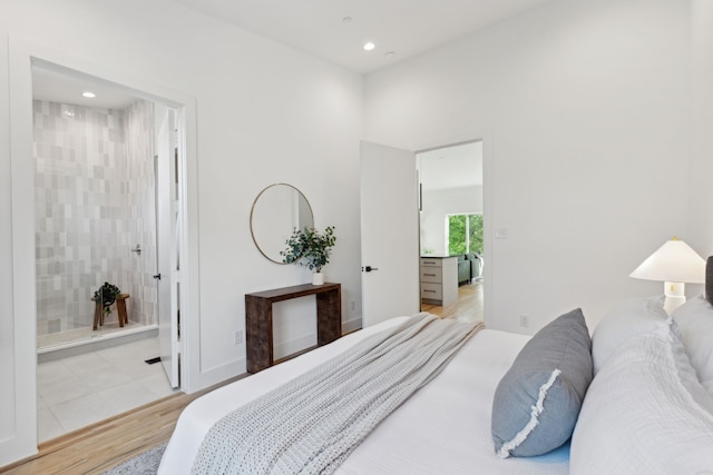 2142 Lovedale Ave Unit 101, Dallas, TX 75235 - bedroom featuring ensuite bathroom, light wood finished floors, and recessed lighting
