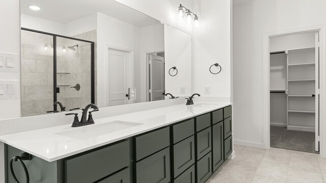 724 Hidden Feather, Lavon, TX 75166 - full bathroom featuring double vanity, a stall shower, and a spacious closet