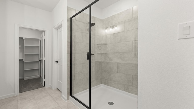 724 Hidden Feather, Lavon, TX 75166 - full bath featuring a stall shower, a walk in closet, and tile patterned floors